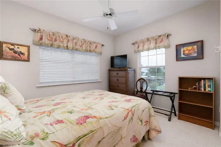 Bedroom featuring carpet and a ceiling fan