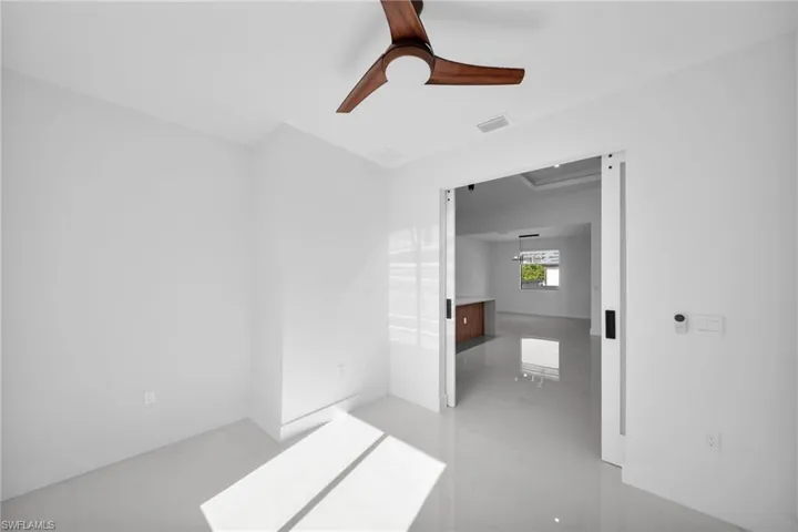 Unfurnished bedroom with ceiling fan