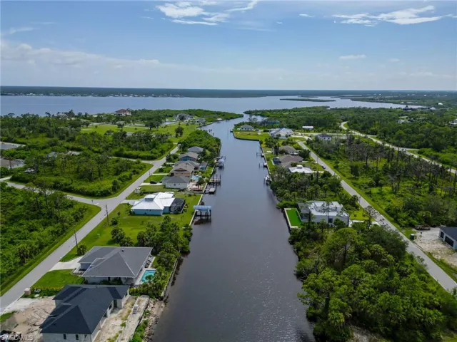 Aerial perspective of suburban area with a large body of water
