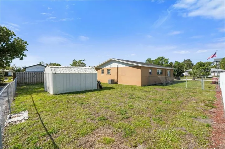 Fenced backyard with a shed