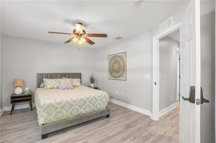 Bedroom featuring light wood-style floors and ceiling fan