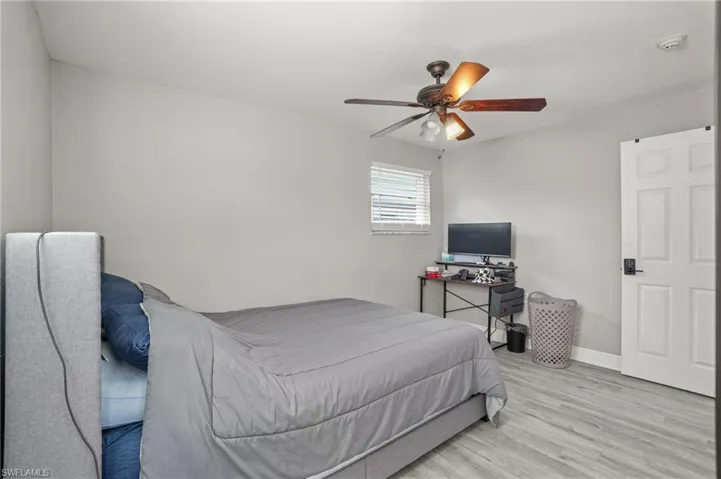 Bedroom with light wood-style flooring and ceiling fan