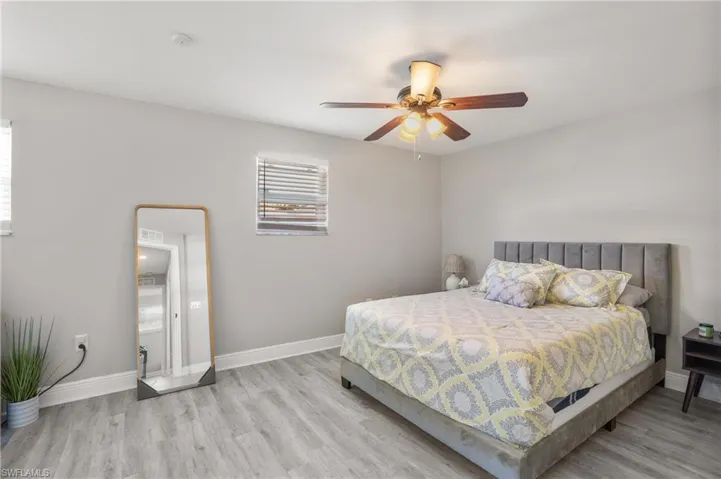Bedroom featuring wood finished floors and ceiling fan