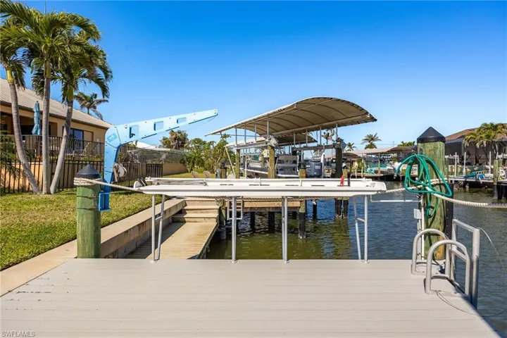 Dock featuring a water view and boat lift