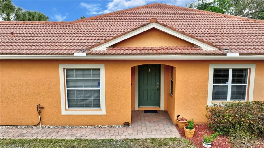 Front door is accessed on the side of the home