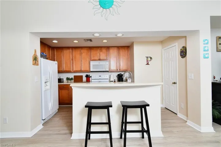 Kitchen features bar seating and pantry