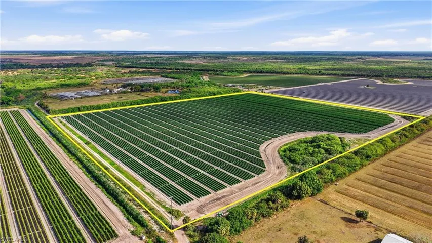 Aerial view of sparsely populated area featuring abundant farmland and property boundaries highlighted
