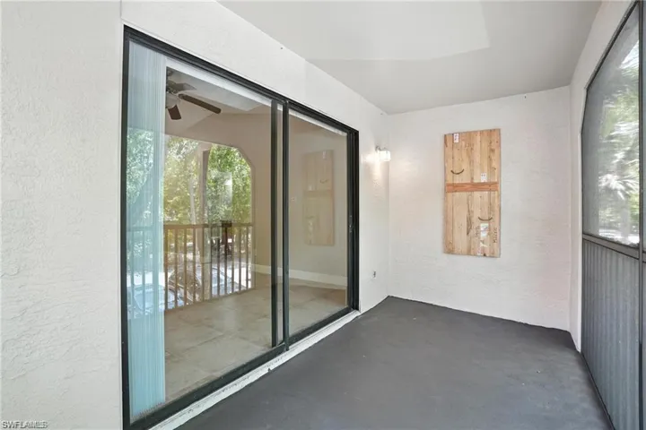 Unfurnished sunroom with a ceiling fan