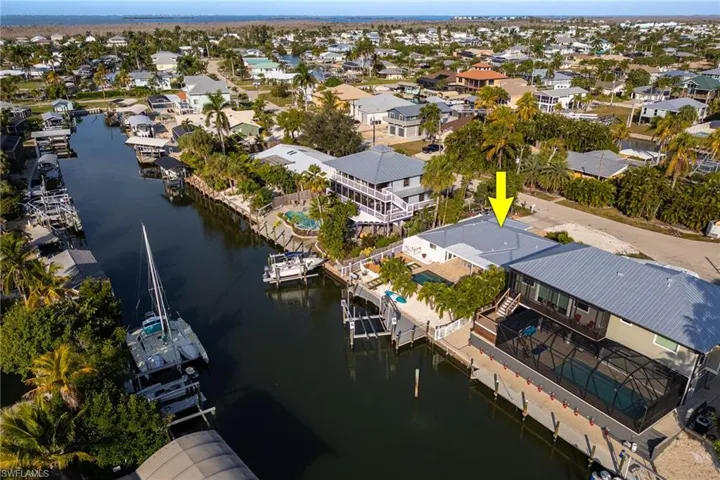 Aerial view of residential area with a large body of water