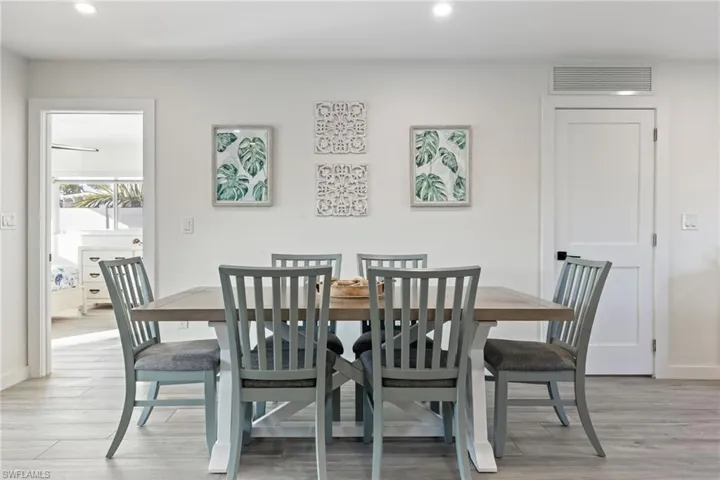 Dining room featuring light wood-style flooring and recessed lighting
