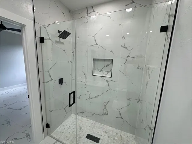 Bathroom with a shower with shower door