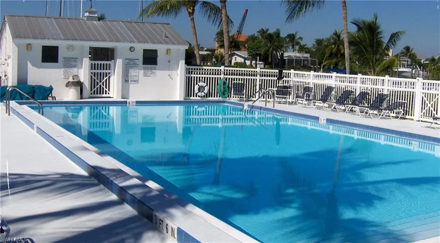 Community pool with a patio