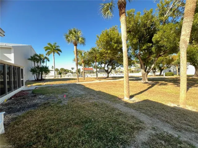 View of green lawn leading to the canal and boardwalk