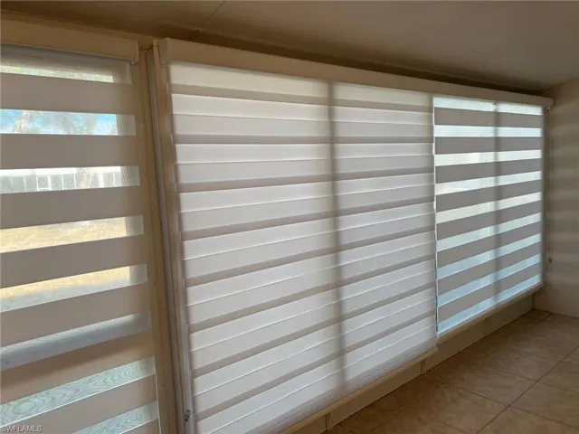 Lanai with privacy window treatments