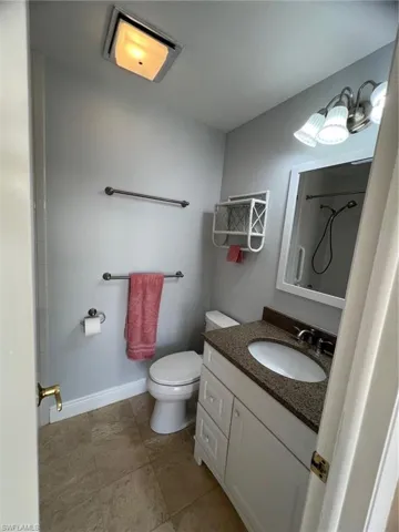 Bathroom featuring vanity, a shower, and tub
