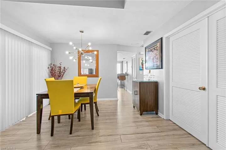 Dining room with a chandelier and light wood-style floors