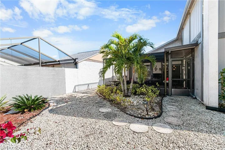 View of yard featuring a sunroom