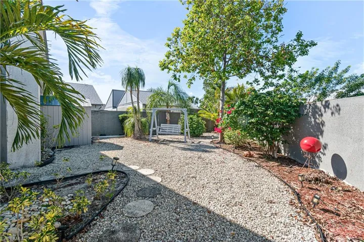 View of fenced backyard