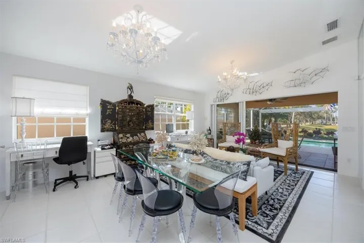 Dining room with an inviting chandelier and light tile patterned flooring