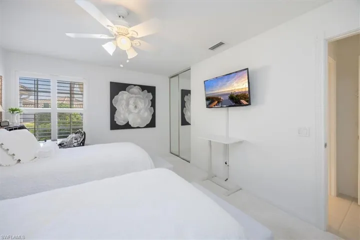 Bedroom with a closet and ceiling fan