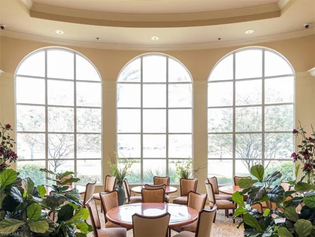 Sunroom / solarium with a raised ceiling
