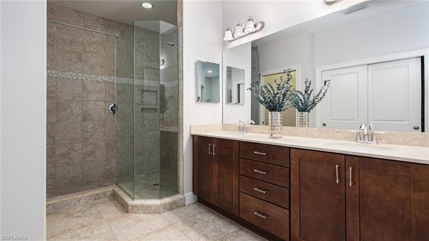 Master bath - dual sinks - tile to the ceiling