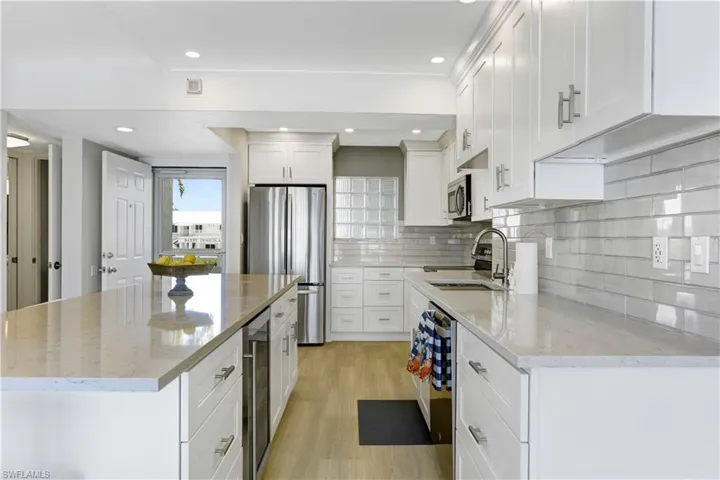 Wine fridge, stainless appliances.