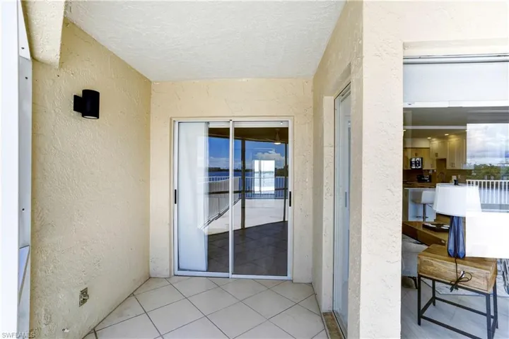 Sliders off of the guest bedroom out to the balcony.