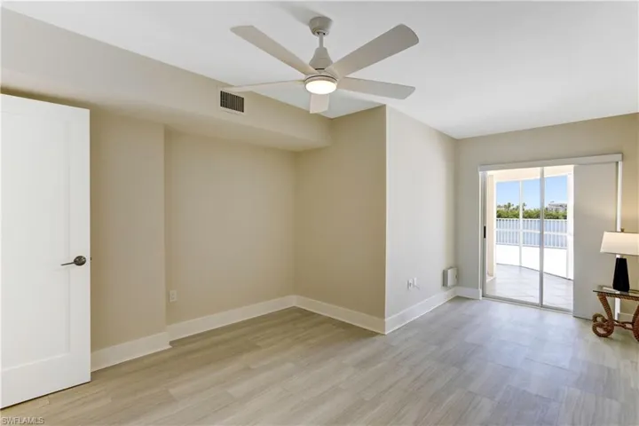 Guest bedroom with extra space for an office/sitting area.