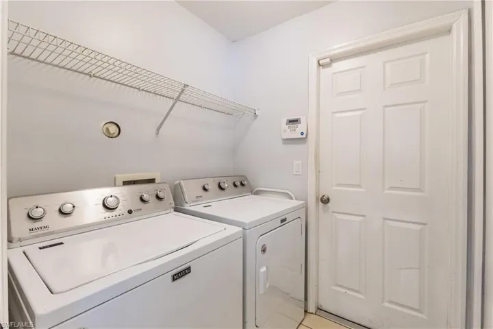 Washroom featuring washer and dryer