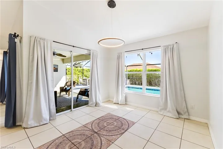 Unfurnished dining area featuring light tile patterned floors