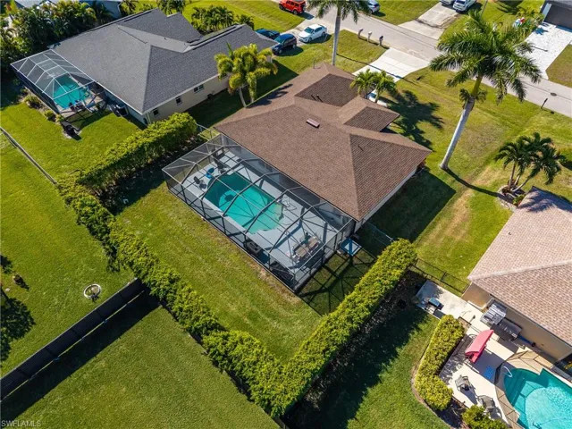 Aerial view of residential area featuring a pool