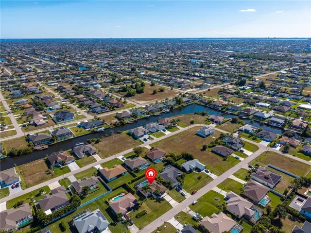 View of property location featuring nearby suburban area and a large body of water