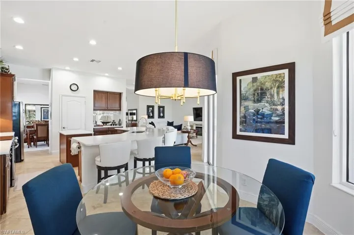 Dining room with recessed lighting and light tile patterned floors