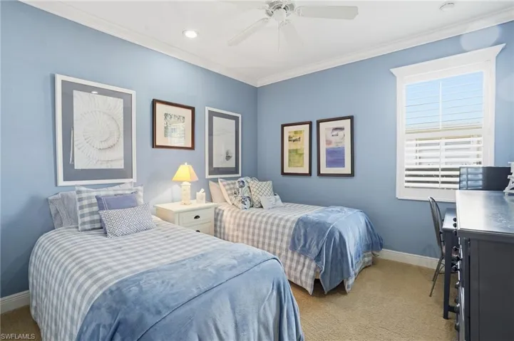 Bedroom featuring ornamental molding, light carpet, a ceiling fan, an office area, and recessed lighting