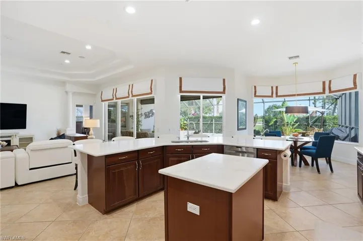 Kitchen featuring recessed lighting, open floor plan, light tile patterned flooring, and pendant lighting