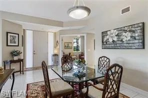 Dining room featuring tile patterned floors and baseboards