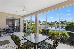 Sunroom with a water view