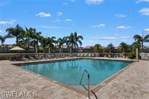 Community pool with a patio area