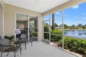 Sunroom / solarium with a water view