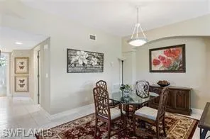 Dining room with baseboards and light tile patterned floors