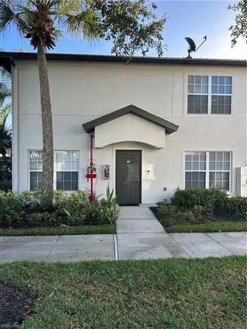 View of front facade featuring stucco siding