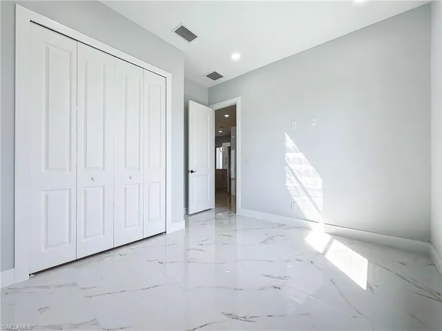 Unfurnished bedroom featuring a closet