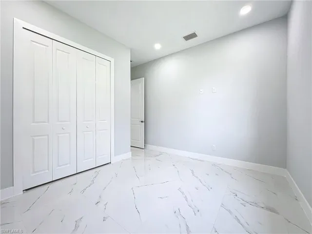 Unfurnished bedroom featuring a closet