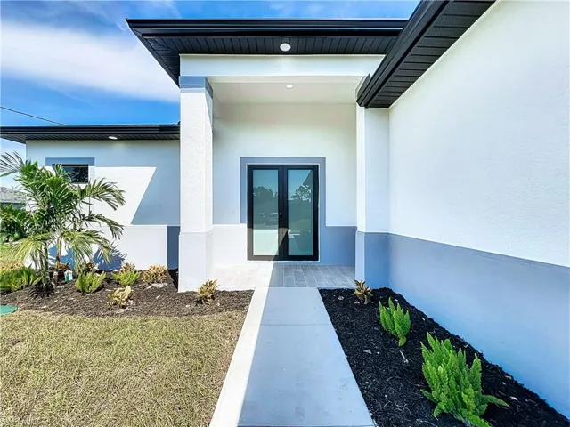 Doorway to property featuring french doors