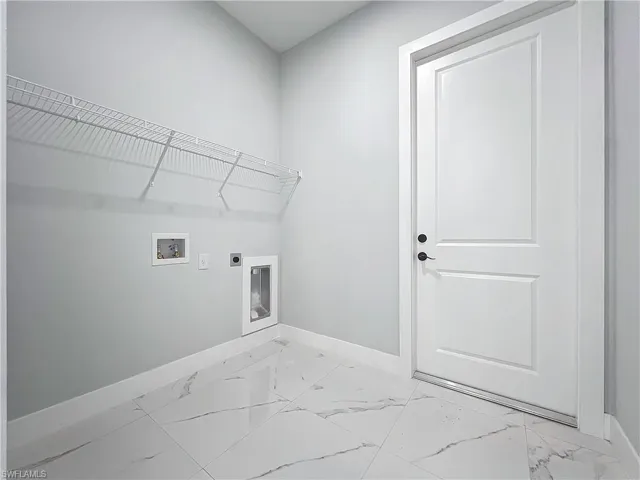 Laundry area featuring hookup for an electric dryer and hookup for a washing machine