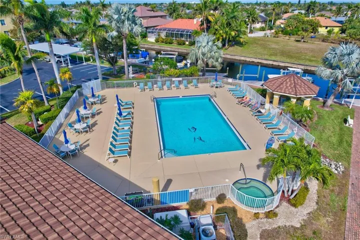 View of pool featuring a patio and hot tub