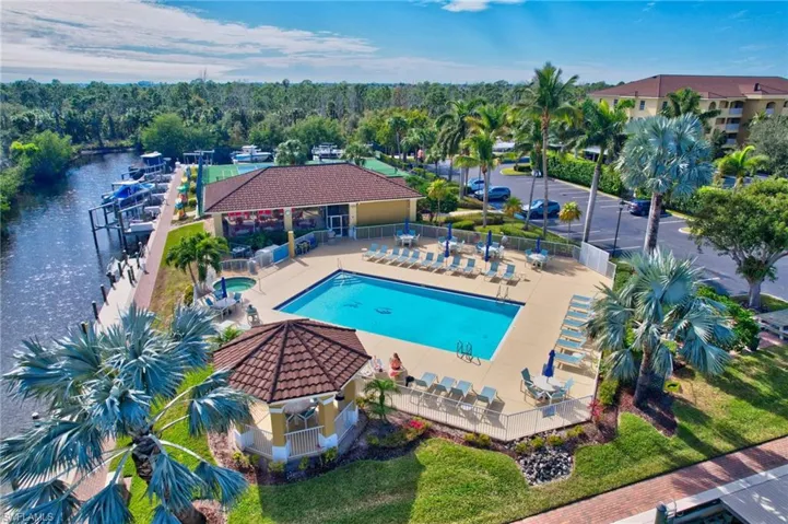 View of swimming pool featuring a patio and a water view