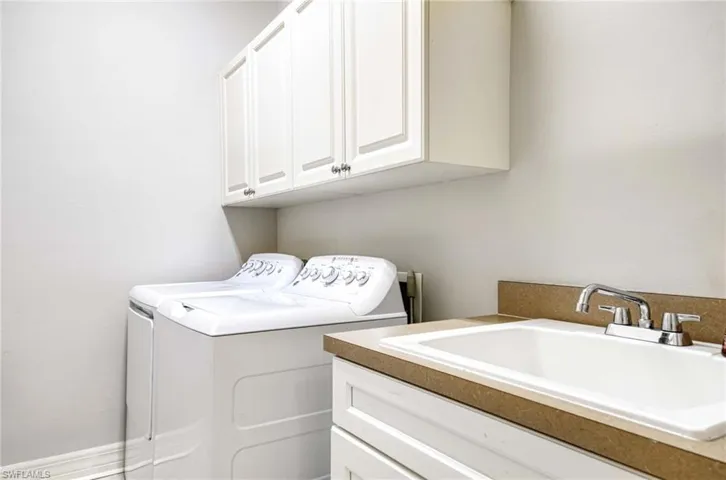 Washroom with independent washer and dryer and cabinet space