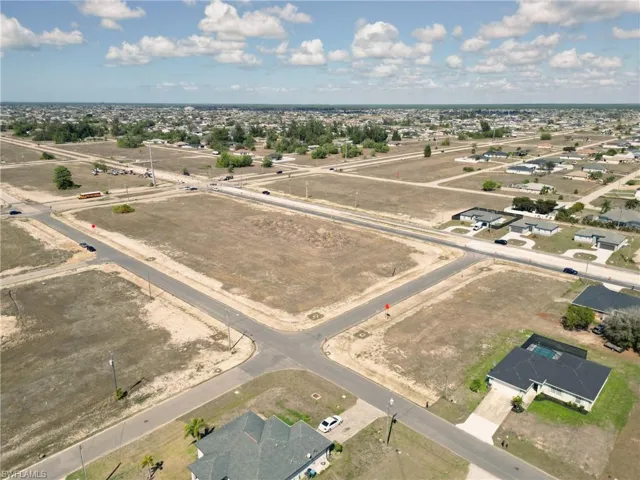View of property location with nearby suburban area